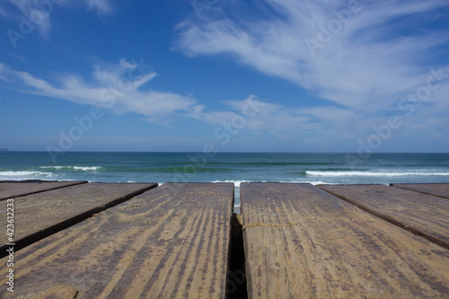 Empty wooden banner background for product  in front of the beach and sea. natural stand  stage