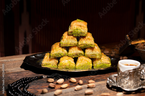 Traditional Turkish Ramadan dessert - baklava with pistachios (Turkish: fistikli baklava). Eid mubarak.  Ramazan bayrami. Ramadan kareem. photo