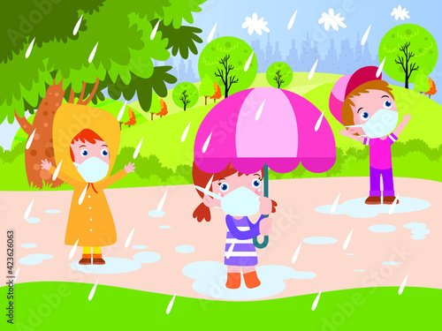 Happy children playing rain drops while wearing raincoat, umbrella, and face mask at the park