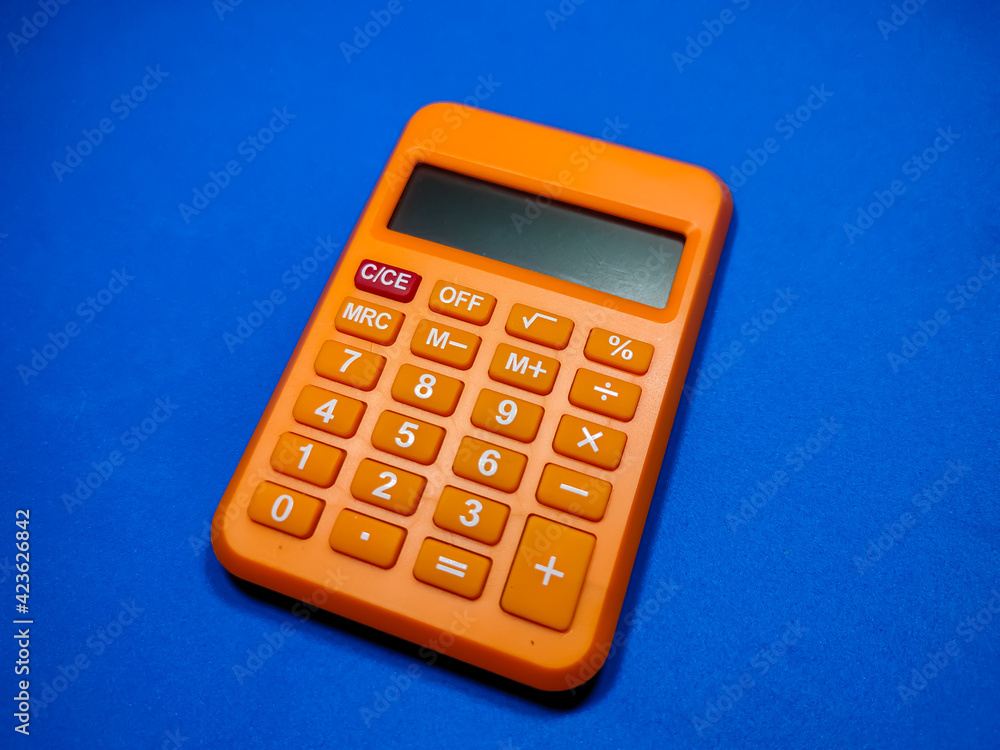 Selective focus of calculator on blue background. Selective focus of calculator on blue background.