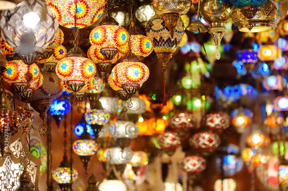 Sale of exotic Mosaic Ottoman lamps in Grand Bazaar in Istanbul, Turkey. Shopping. Gifts and souvenirs from travels.