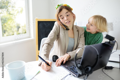 Quadro em tela Young woman working from home with laptop during quarantine