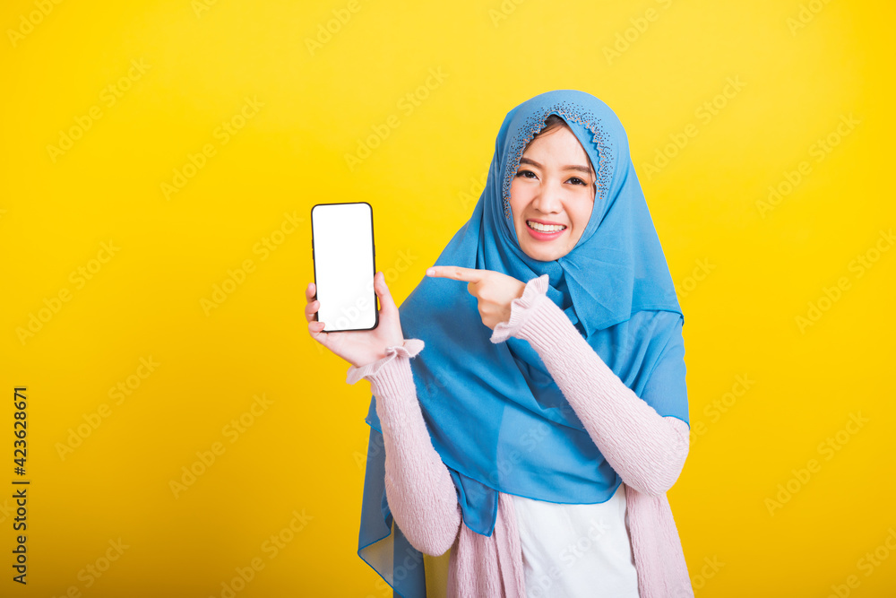 Asian Muslim Arab woman Islam wear veil funny smile she showing blank screen smart mobile phone