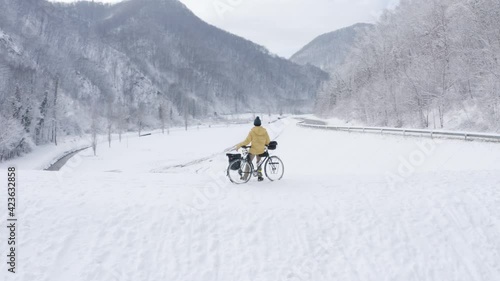 Aerial view of young man admiring winter landscape at Zumberak, Croatia.