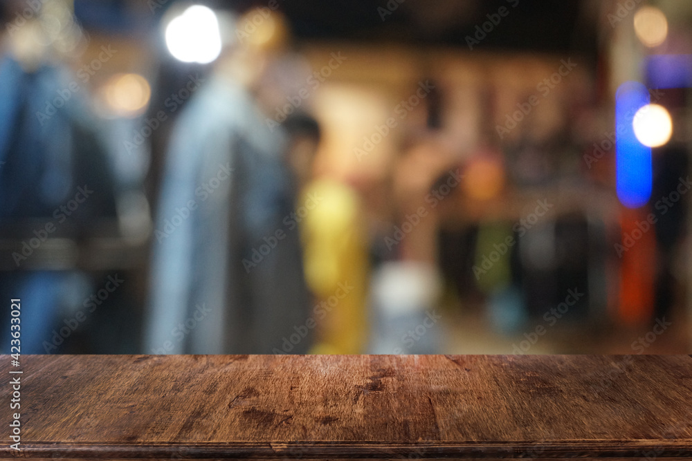 Empty dark wooden table in front of abstract blurred bokeh background of restaurant . can be used for display or montage your products.Mock up for space. Empty dark wooden table in front of abstract blurred bokeh background of restaurant . can be used for display or montage your products.Mock up for space.