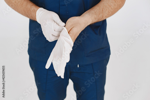 A portrait of a medical doctor posing against white background