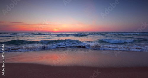 Ocean beach sunrise and dramatic colorful sky clouds, 4K Video	