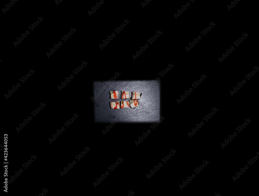 Obraz premium SUSHI ROLLS and classic sushi and soups with some sweets, menu for sushi bar