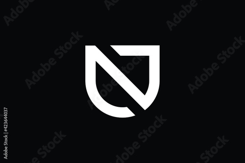 NU logo letter design on luxury background. UN logo monogram initials letter concept. NU icon logo design. UN elegant and Professional letter icon design on black background. N U UN NU