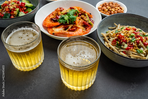 A table of Chinese home cooking and beer