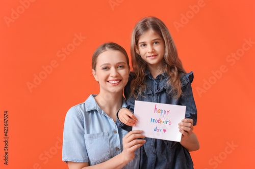 Little girl and her mom wit...