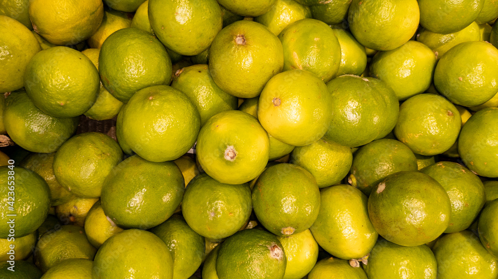 Ripe green Lemons Closeup as Background Texture in wallpaper Harvest natural