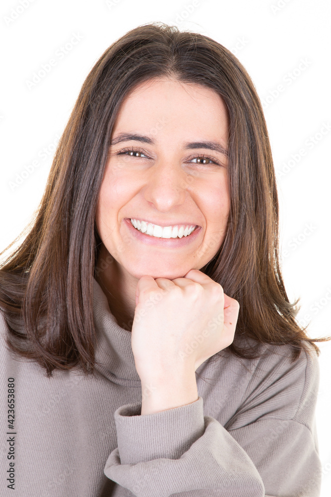 Beautiful young brunette woman smiling cute girl with long hair brown hand under chin Isolated on white background Beautiful young brunette woman smiling cute girl with long hair brown hand under chin Isolated on white background