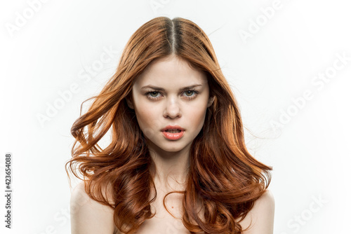 cheerful woman attractive look naked shoulders loose hair light background