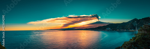 Panoramic view of Mount Etna at sunset by the sea. Last eruption of Mt Etna