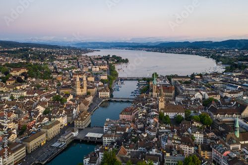 Aerial view of the twilight over Zurich old town where the Limmat river reaches lake Zurich in Switzerland largest city.