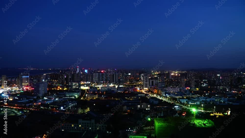 Time-lapse photography of a bustling city from dusk to bright night Time-lapse photography of a bustling city from dusk to bright night