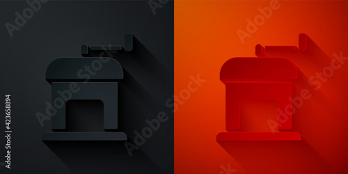 Paper cut Manual coffee grinder icon isolated on black and red background. Paper art style. Vector