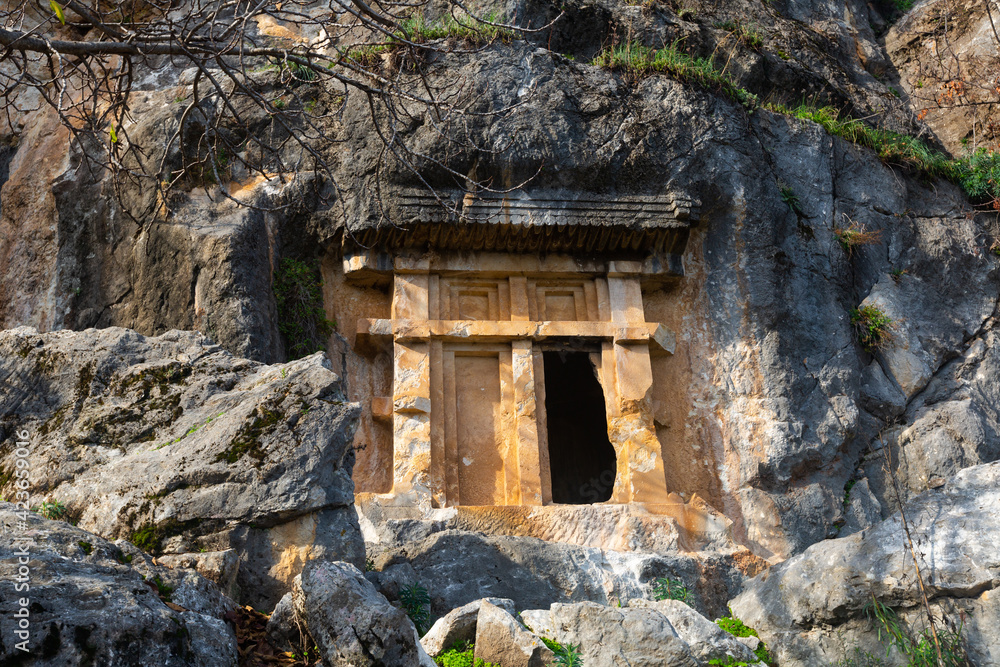 Impressive view of tombs carved in crag in ancient Lycian city of Pinara in Turkey