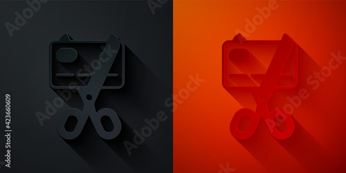 Paper cut Scissors cutting a credit card icon isolated on black and red background. Online payment. Cash withdrawal. Financial operations. Shopping sign. Paper art style. Vector