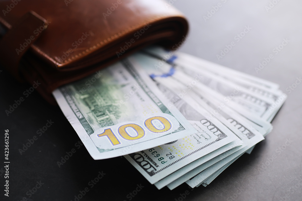 Group of money stack of 100 US dollars banknotes a lot of the background texture. Cash money in a large pile as a finance background. Group of money stack of 100 US dollars banknotes a lot of the background texture. Cash money in a large pile as a finance background.