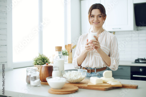 Woman food. Young woman in the kitchen at home. High quality photo.