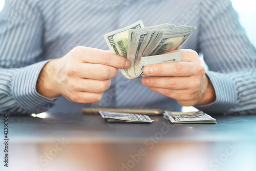 Group of money stack of 100 US dollars banknotes a lot of the background texture. Cash money in a large pile as a finance background.