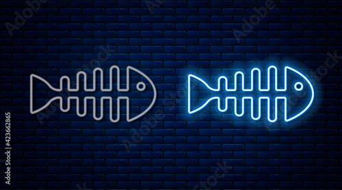 Glowing neon line Fish skeleton icon isolated on brick wall background. Fish bone sign. Vector
