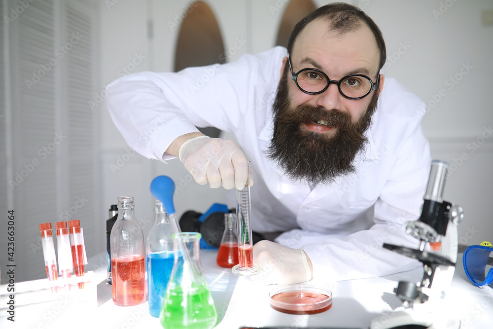 Chemist crazy. A mad scientist conducts experiments in a scientific laboratory. Performs research using a microscope. Chemist crazy. A mad scientist conducts experiments in a scientific laboratory. Performs research using a microscope.