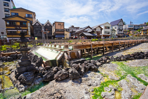 Yubatake onsen, hot spring wooden boxes with mineral water in Kusatsu onsen, Gunma prefecture, Japan photo