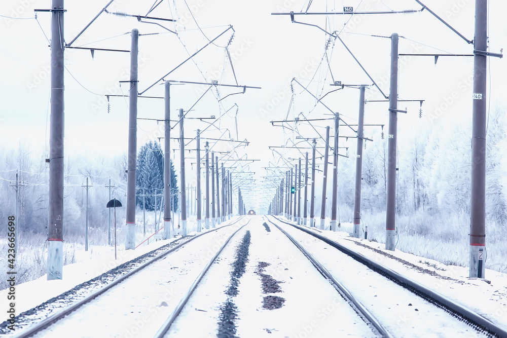 winter railway landscape, view of the rails and wires of the railway, winter delivery way