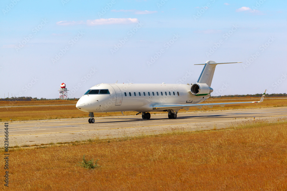 Big passenger airplane drives along the runway in airport Big passenger airplane drives along the runway in airport
