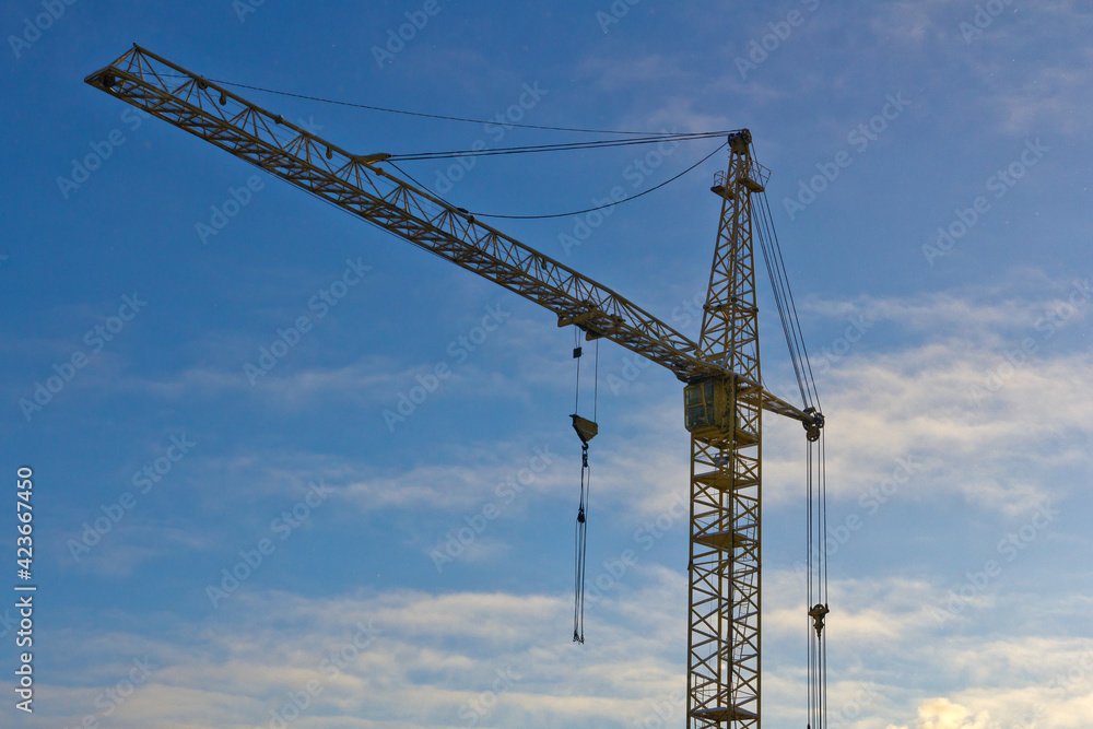 construction crane on building a house construction crane on building a house