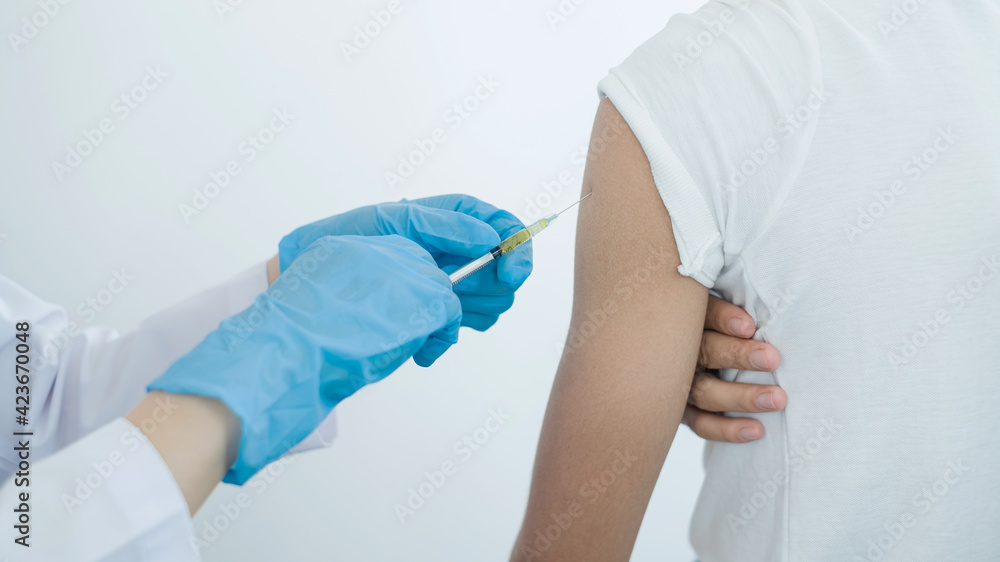 Fototapeta premium Female doctors vaccinated with syringes to prevent epidemics at hospitals, health care, and medical concepts