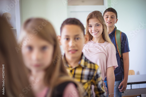 Multiethnic children in classroom.