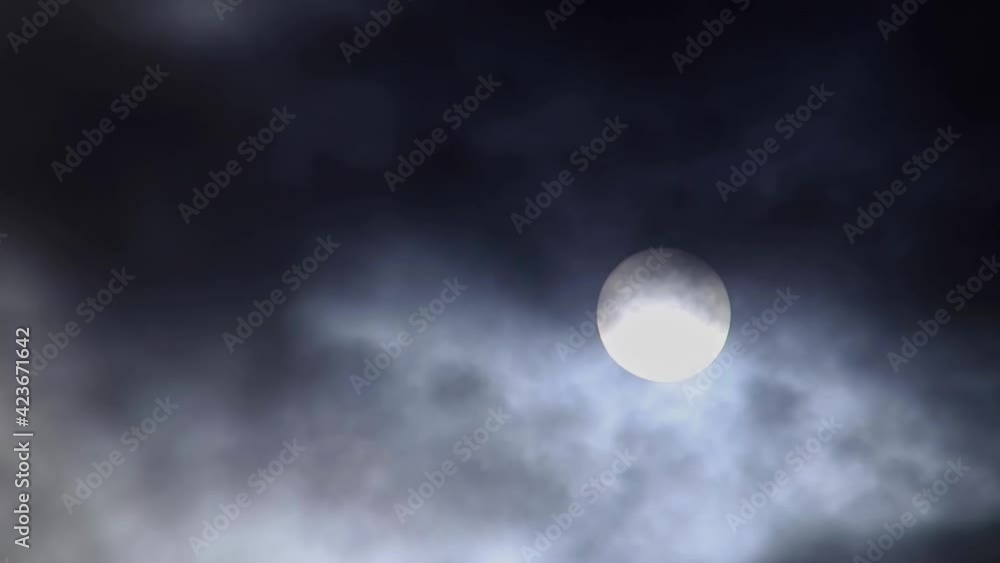 Time-lapse photography of a full moon slowly rising in the midair through flowing clouds at night Time-lapse photography of a full moon slowly rising in the midair through flowing clouds at night
