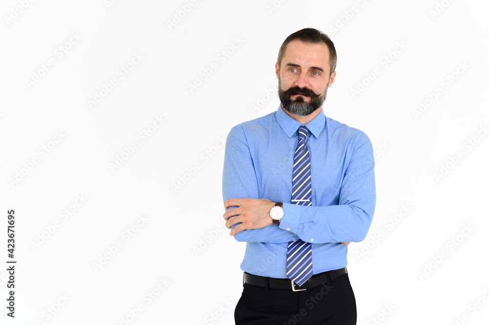 Portrait of confident middle-aged businessman in blue shirt with a beard and mustache standing on white background with copy space
