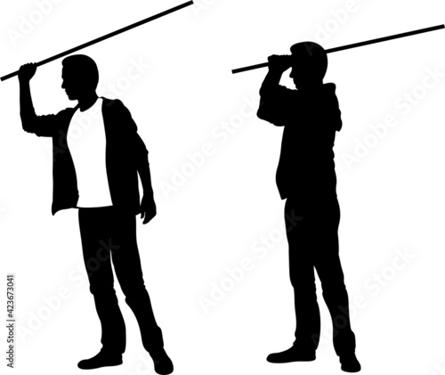 silhouettes of men hitting with stick