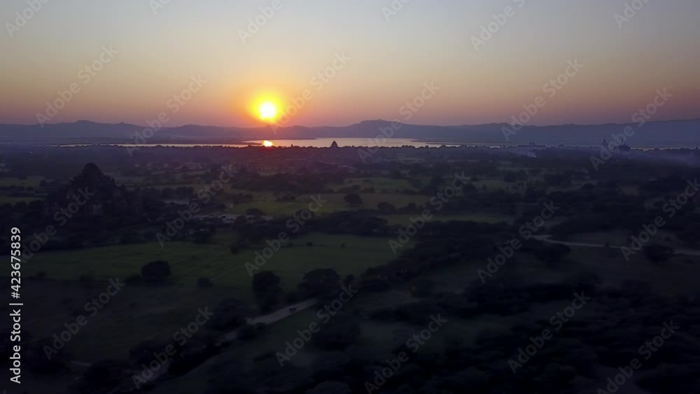 Magical Golden Sunrise Over Temple, Wild Landscape and Lake in Horizon, Bagan, Myanmar, Aerial Magical Golden Sunrise Over Temple, Wild Landscape and Lake in Horizon, Bagan, Myanmar, Aerial