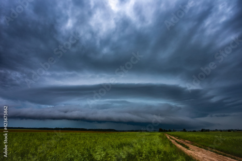 Supercell storm clouds with wall cloud and intense rain
