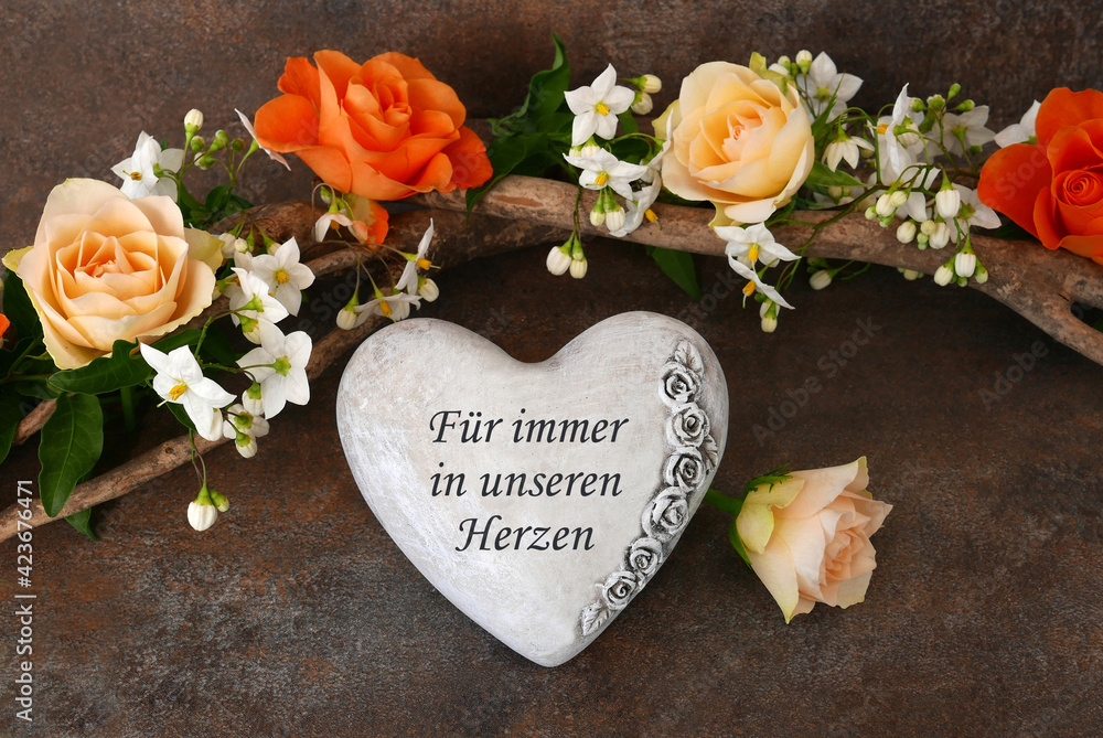 GrabschmuckHerz mit der Inschrift für immer in unseren Herzen. Stock