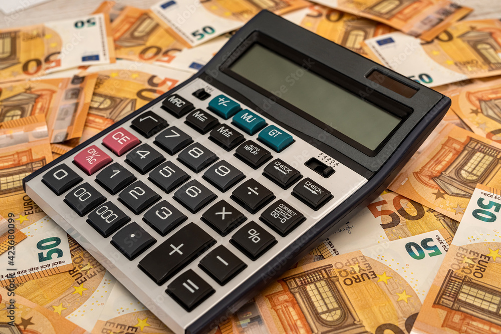 business and exchange concept with euro cash and calculator business and exchange concept with euro cash and calculator