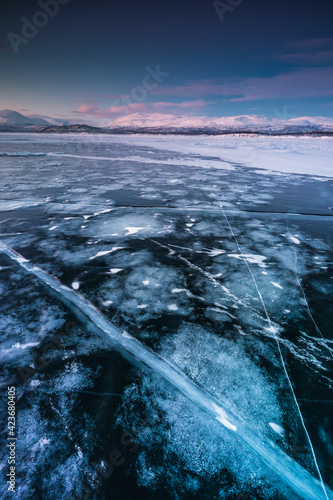 The frozen lake Torneträsk in Swedish Lapland. Beautiful ice forms create an amazing sight. 