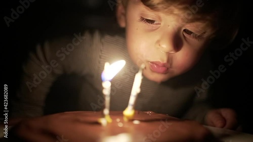 Wallpaper Mural Baby toddler celebrating birthday, child blowing cake candles in slow-motion Torontodigital.ca