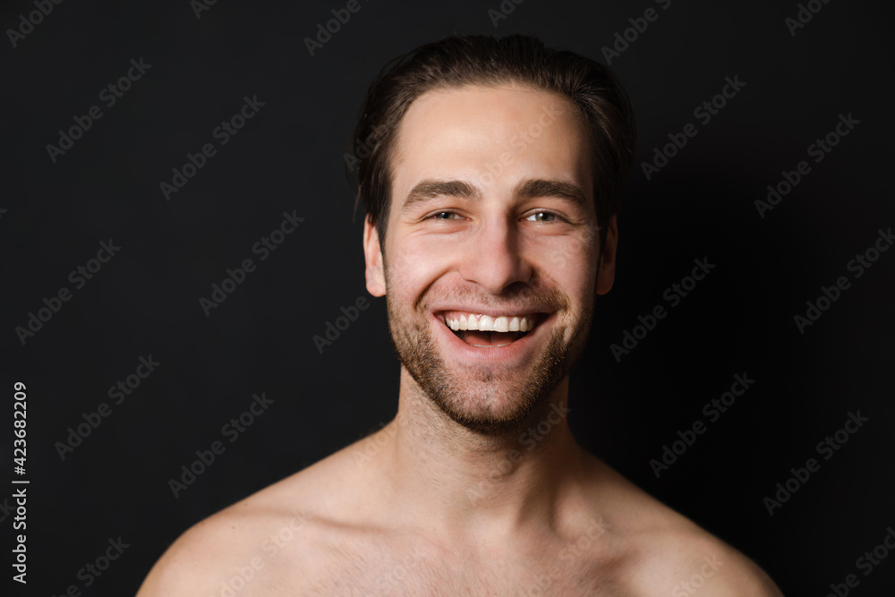 Shirtless white man laughing and looking at camera Shirtless white man laughing and looking at camera