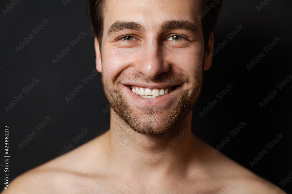 Shirtless white man smiling and looking at camera Shirtless white man smiling and looking at camera