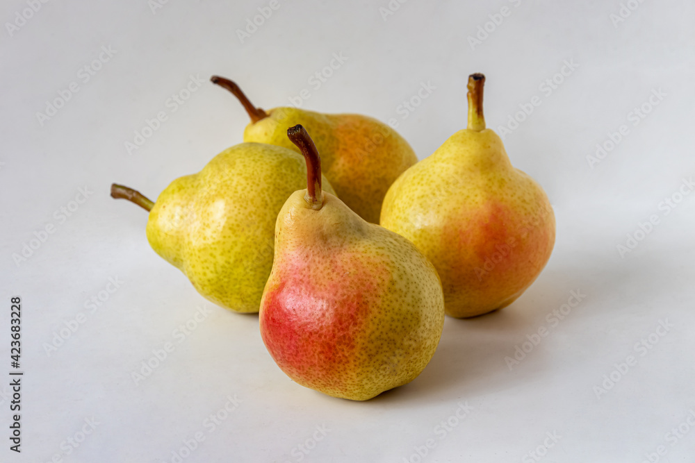 Four ripe yellow pears with red sides Four ripe yellow pears with red sides