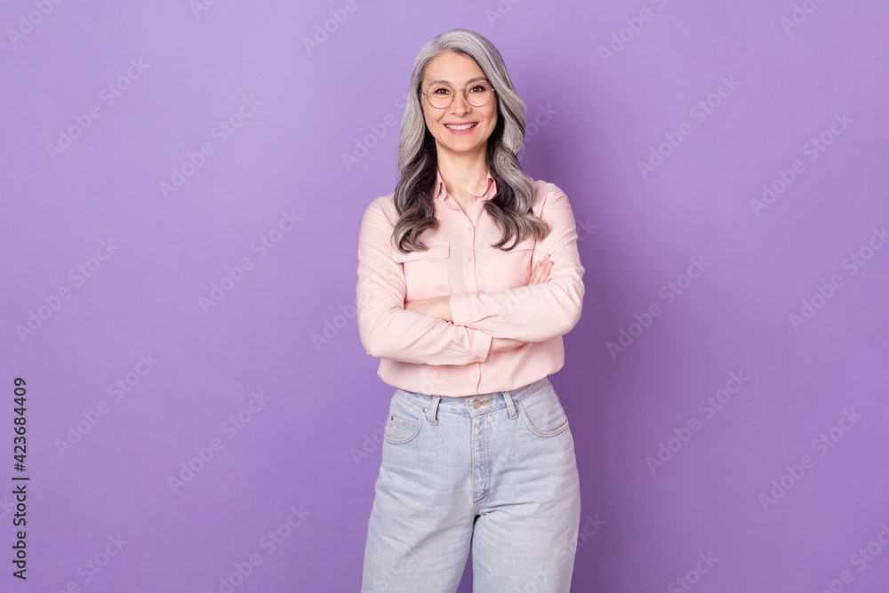 Portrait of attractive clever smart cheerful woman librarian folded arms isolated over violet purple color background Portrait of attractive clever smart cheerful woman librarian folded arms isolated over violet purple color background