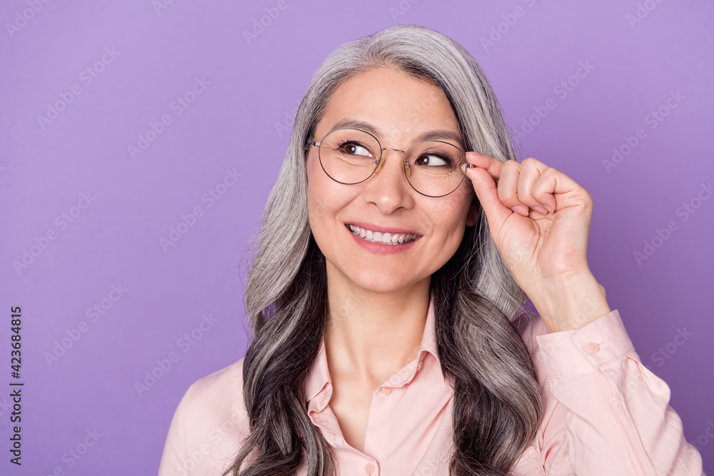 Close-up portrait of attractive cheerful trendy curious woman touching eyewear thinking isolated over violet purple color background Close-up portrait of attractive cheerful trendy curious woman touching eyewear thinking isolated over violet purple color background