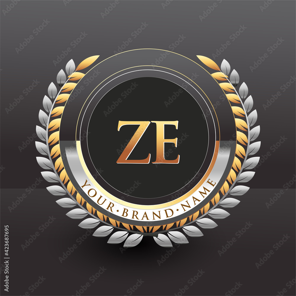 Initial logo letter ZE with golden and silver color with laurel and